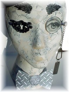 a white mannequin head with music notes on it's face and eyes