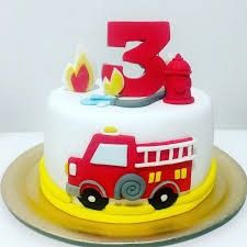 a three year old birthday cake with a firetruck and number 3 on top