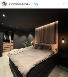 a large bed sitting in the middle of a bedroom