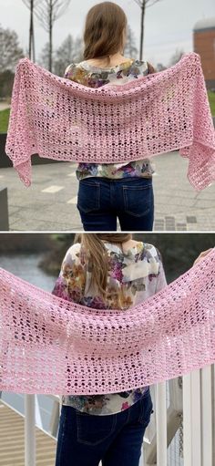 a woman standing on top of a bridge wearing a pink shawl