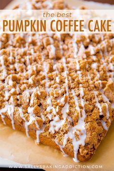 the best pumpkin coffee cake with white icing on top is sitting on a cutting board