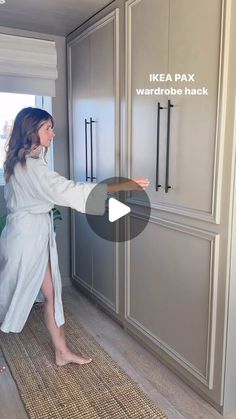 a woman in a bathrobe pointing at the refrigerator