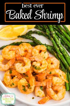 the best ever baked shrimp served with asparagus and lemon wedges on a white plate