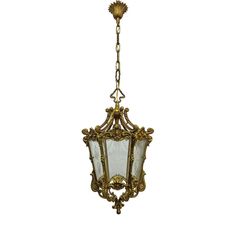 an antique chandelier hanging from the ceiling