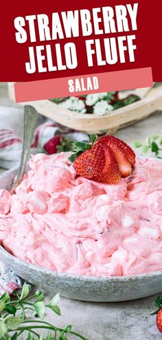 strawberry jello fluff in a bowl with strawberries on the side