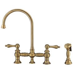 an antique brass kitchen faucet with two handles