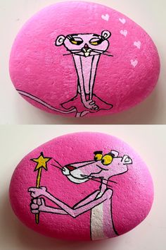 two rocks with cartoon characters painted on them, one is pink and the other is white