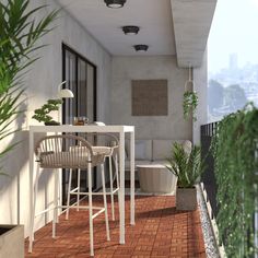 a balcony with chairs, table and potted plants