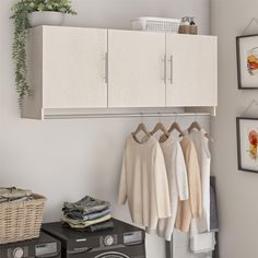 Convert unused wall space into storage with the Systembuild Evolution Camberly 3 Door Wall Cabinet with Hanging Rod. Made of laminated MDF and particleboard, this sturdy storage solution is sure to get you organized. Use the concealed storage of the Wall Cabinet for laundry essentials and cleaning supplies, and hang your cares out to dry on the convenient built in clothing rod below. The interior of each of the 3 Cabinets features 1 adjustable and 1 fixed shelf. The EZ Hang system makes hanging the Wall Cabinet quick and easy. Simply attach and level the support bar on the wall and hook the Wall Cabinet on for a sturdy and level hang on the first try. Use this piece as a stand-alone item, or combine it with additional Systembuild Evolution Camberly storage items to create the perfect stora Hanging Cupboard Bedroom, Slim Wall Storage, Ikea Wall Cabinets Bedroom, Hanging Cabinets For Small Bedroom, Hanging Cabinet Bedroom, Wall Cupboard Bedroom, Bedroom Wall Storage Ideas, Hanging Cabinets Bedroom, Wall Storage Bedroom