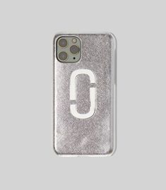 an iphone case with the letter c on it in silver glitter and white lettering, against a gray background