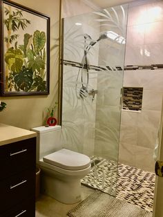 a bathroom with a shower, toilet and sink in it's center piece is shown