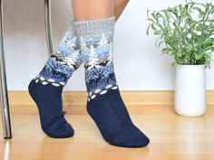 Beautiful and high-quality socks. Socks are soft and warm. Inspired by Scandinavian style. Design is made according to the national traditions of Nordic jacquard. Navy socks with winter landscape. Running moose and white trees covered with snow. Socks are handcrafted and have a great quality. Made out of natural alpaca and lambswool in Estonia. Care instructions: Gentle wash by hand at warm water temperatures of 30-40 Celsius (80-104 F). Do not rub or twist the products. Check other socks as wel Fair Isle Socks, Navy Socks, Colorwork Chart, Woolen Socks, White Trees, Alpaca Socks, Crochet Winter Hats, Winter Hats For Men, Crochet Winter