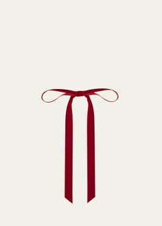 a red ribbon tied to the side of a white wall with a bow on it