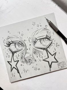 a pencil drawing of two faces with stars on the forehead and eyes drawn in black ink