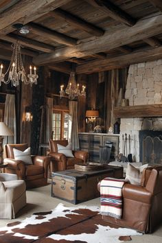 Experience the perfect blend of rugged and refined in this modern rustic cabin. Crystal chandeliers illuminate the space, contrasting beautifully with the natural wood beams and warm leather seating. Ideal for those seeking inspiration for luxurious yet rustic interiors. #RusticModern #LuxuryCabinStyle #RusticLighting