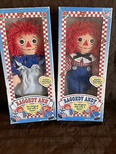 two raggedy andy dolls in their original packaging