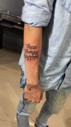 a man with a tattoo on his arm that says, these things happen