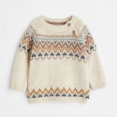 an image of a child's sweater on a white background