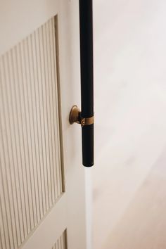 an open door with a black handle on it