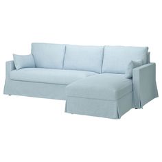 a light blue couch and ottoman on a white background with the cover pulled back from the sofa