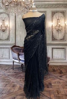 Beautiful black net saree with sequins embroidery and running net blouse piece. Designer Net Pre-draped Saree With Unstitched Blouse, Black Pre-draped Saree With Sequins, Party Pre-draped Saree With Mirror Work In Net, Net Pre-draped Saree For Festive Party Wear, Traditional Drape Sequin Fabric With Mirror Work For Evening, Evening Organza Saree With Resham Embroidery, Evening Saree With Resham Embroidery In Organza, Black Organza Lehenga For Evening, Black Embellished Organza Dupatta