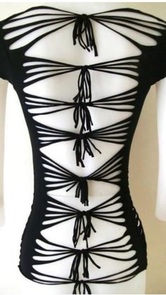 the back of a woman's body with black stringing on it and an attached top