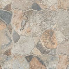 a close up view of a stone floor that looks like it has many different colors and shapes