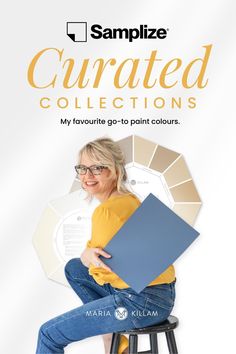 a woman sitting on top of a stool holding a book