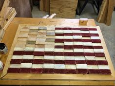 an american flag made out of red, white and blue marble blocks on a workbench