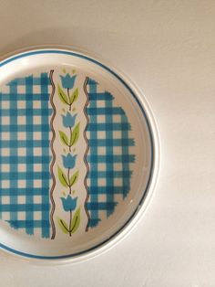 a blue and white plate sitting on top of a table