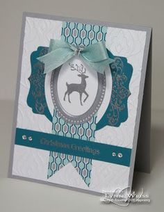 a card with a deer on it and a ribbon tied around the front of it