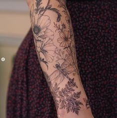 a person with a flower tattoo on their arm