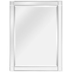 a white framed mirror on a wall with an empty space for the reflection in it