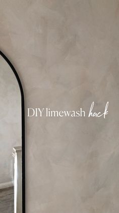 an arched mirror with the words diy linewash back on it's side