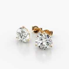 14K Yellow Gold Three Prong Martini Round Diamond Stud Earrings (2.00 CTW - H-I / SI1-SI2). These three-prong martini setting is constructed to fit the exact size of the diamonds used. The diamonds sit perfectly flush into the setting; exactly as the Martini design was intended. Yellow Gold Diamond Stud Earrings, Classic 14k Gold Diamond Earrings With Prong Setting, Yellow Gold Lab Grown Diamond Earrings With Prong Setting, Macy's Classic Yellow Gold Diamond Earrings, Gia Certified Yellow Gold Lab Grown Diamond Earrings, Yellow Gold Round Diamond Earrings With Screw Back, Diamond Earrings Studs Round, Gold Diamond Earrings Studs, Lab Created Diamonds