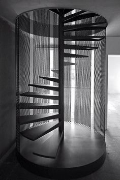 a spiral staircase is shown in black and white