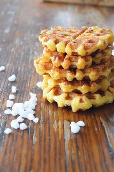 a stack of waffles sitting on top of a wooden table