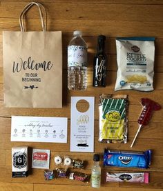 the contents of a bag laid out on top of a wooden table next to some candy