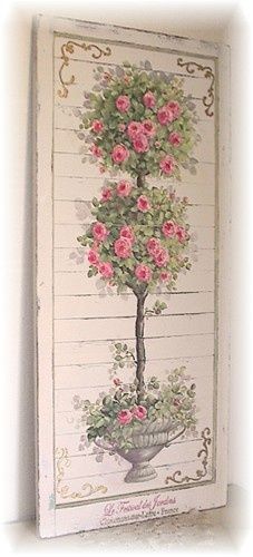 a cross stitch pattern with pink flowers in a vase