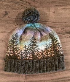 a knitted hat with trees on it