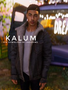 a young man standing in front of a truck