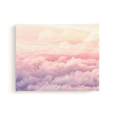 the sky is filled with clouds in pastel colors canvas wall art print by person