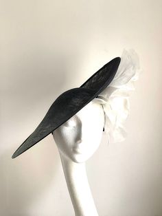 black and white saucer disc hat This amazing black and white hat is made from sinamay base with a white organza and velvet flower attached. This disc hat will make a statement on any occasion. The hat has a wide headband attached with the comb inside for extra security. Large Hats For Women, White Derby Hat, Royal Outfit, Mother Of The Bride Hats, White Fascinator, Black And White Hats, Royal Ascot Hats, Velvet Flower, Ascot Hats