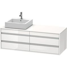 a white bathroom vanity with a sink and drawers