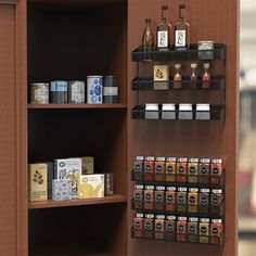 the shelves are filled with different types of spices