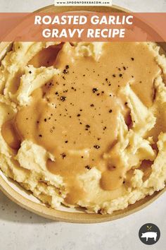 a plate filled with mashed potatoes covered in gravy on top of a table