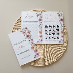 the welcome cards are placed on top of a woven placemat with flowers and animals