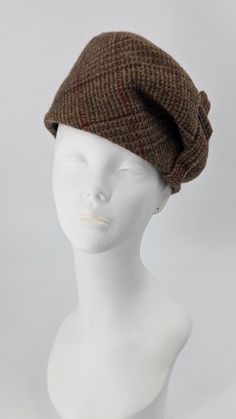 Chic plaid beret made of luxurious English wool.  Keeps you  warm in cozy  shades of brown and burgundy. Fully lined in silk taffeta. Features a self fabric and metal accent. Hand made with care. One of a kind. fits size 22&1/2 to 23rd" head size. Plaid Beret, Aviator Hat, Plush Bags, Chic Scarves, Couture Hats, Wool Berets, Warm Winter Hats, Beret Hat, Brown Plaid