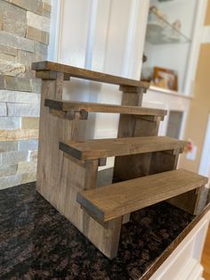 a wooden shelf sitting on top of a counter