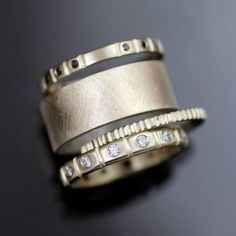 two wedding bands with diamonds on them